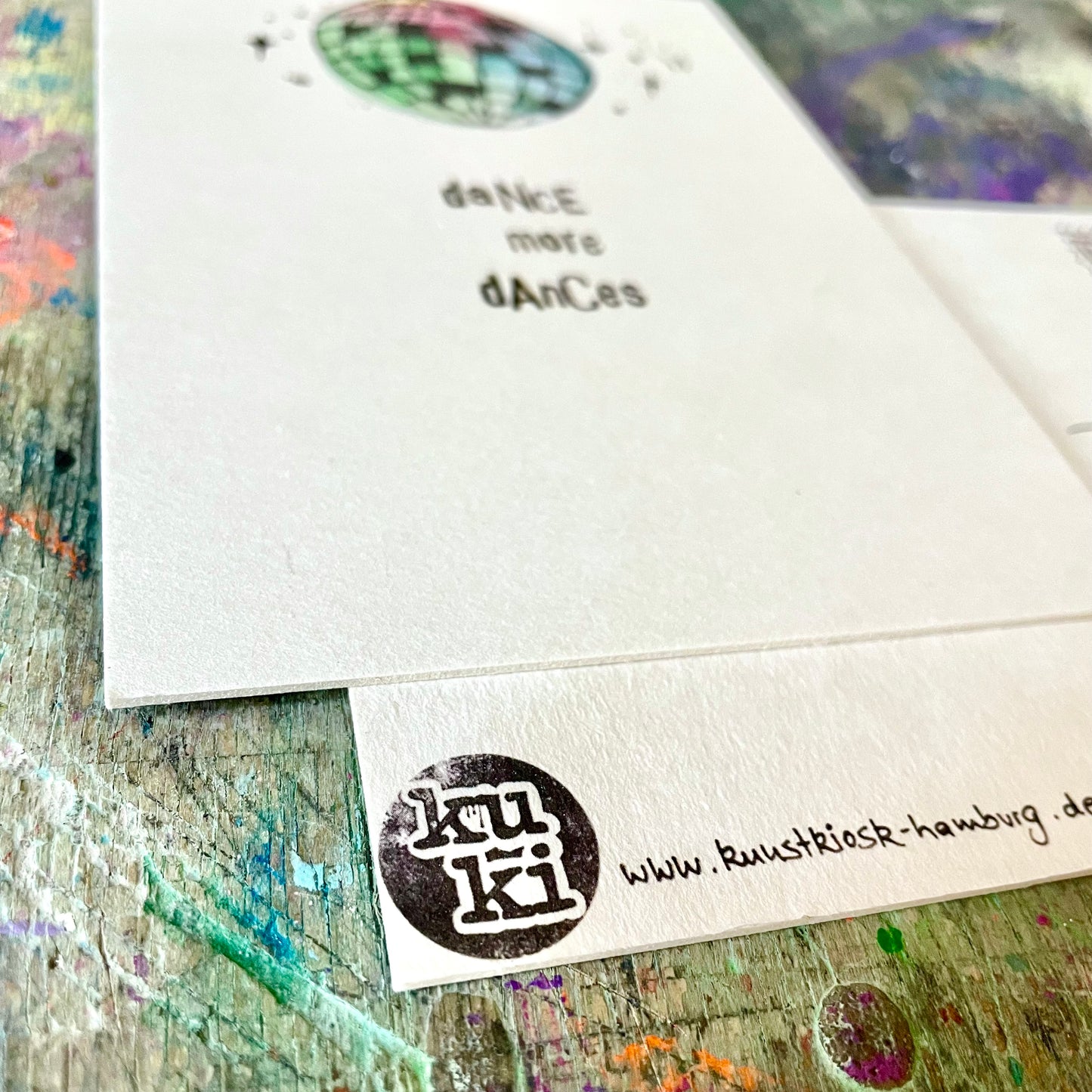 kuki Postkarte "dance more dances"