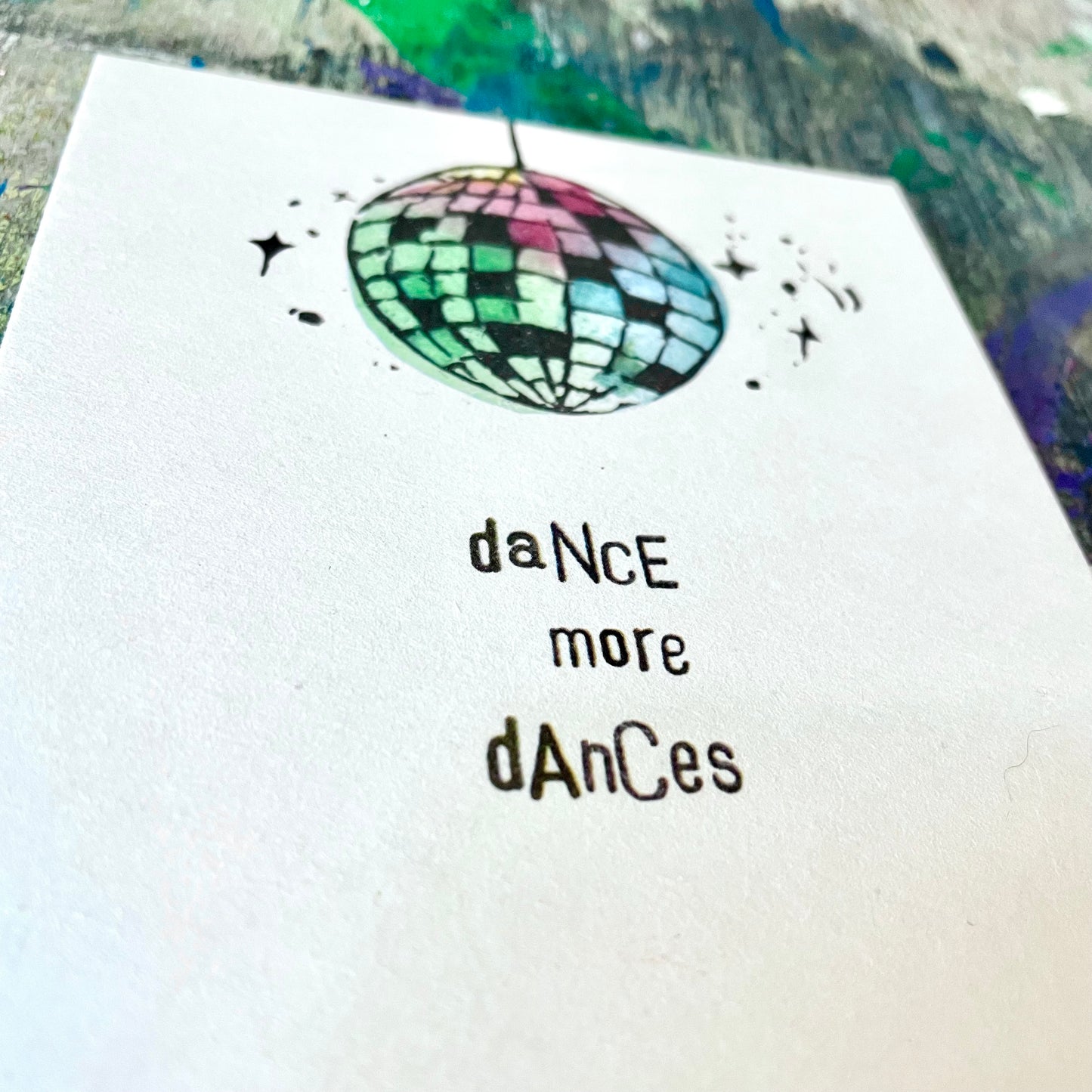 kuki Postkarte "dance more dances"