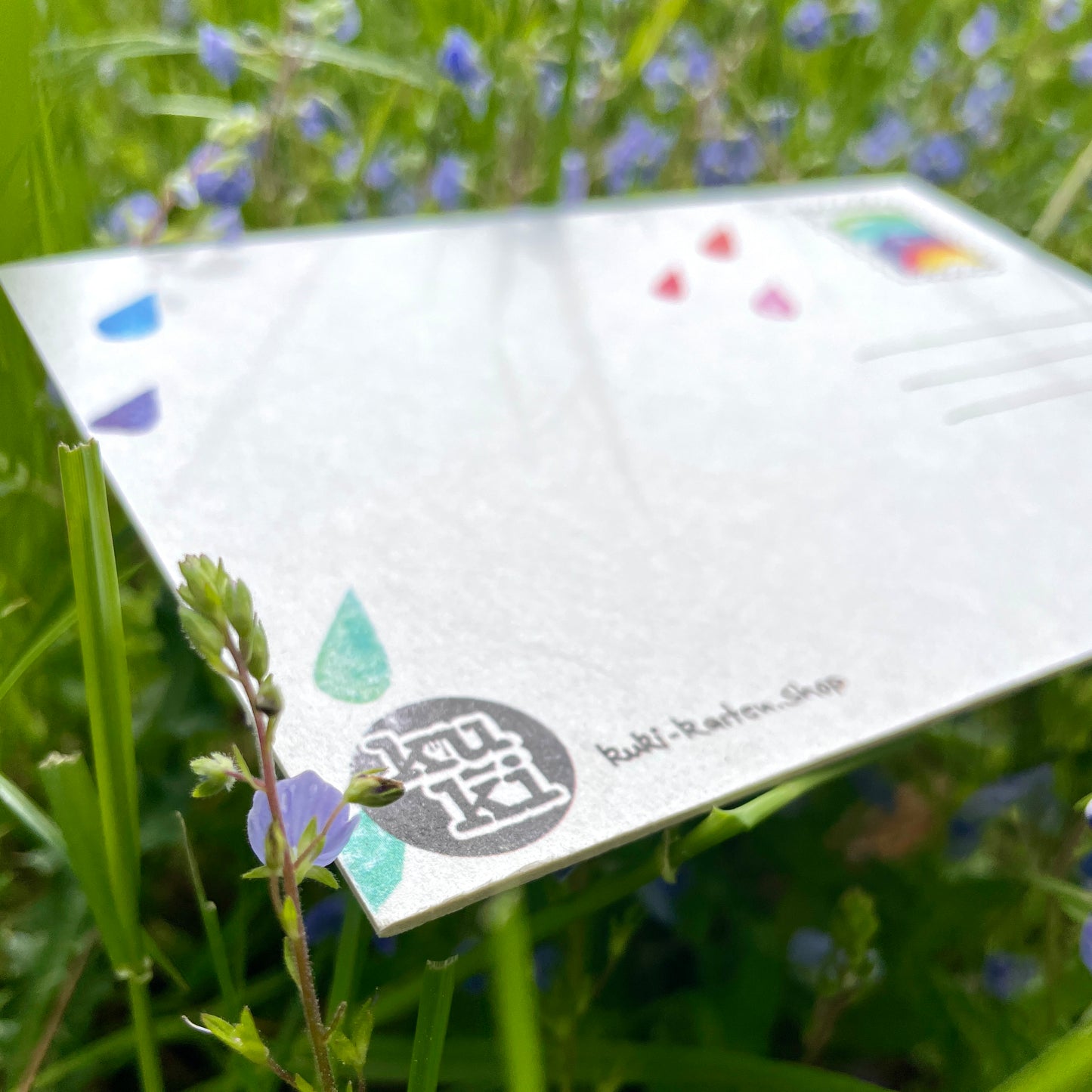 kuki Postkarte „Mit dir ist Regen bunter“